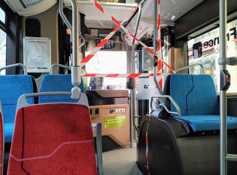 a bus with ribbons that prevents getting close to the driver